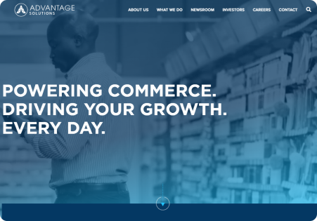 Man working in a store, Advantage Solutions text.