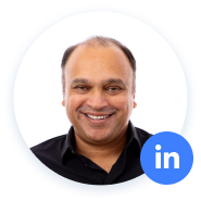 Smiling man with LinkedIn logo in circular frame.